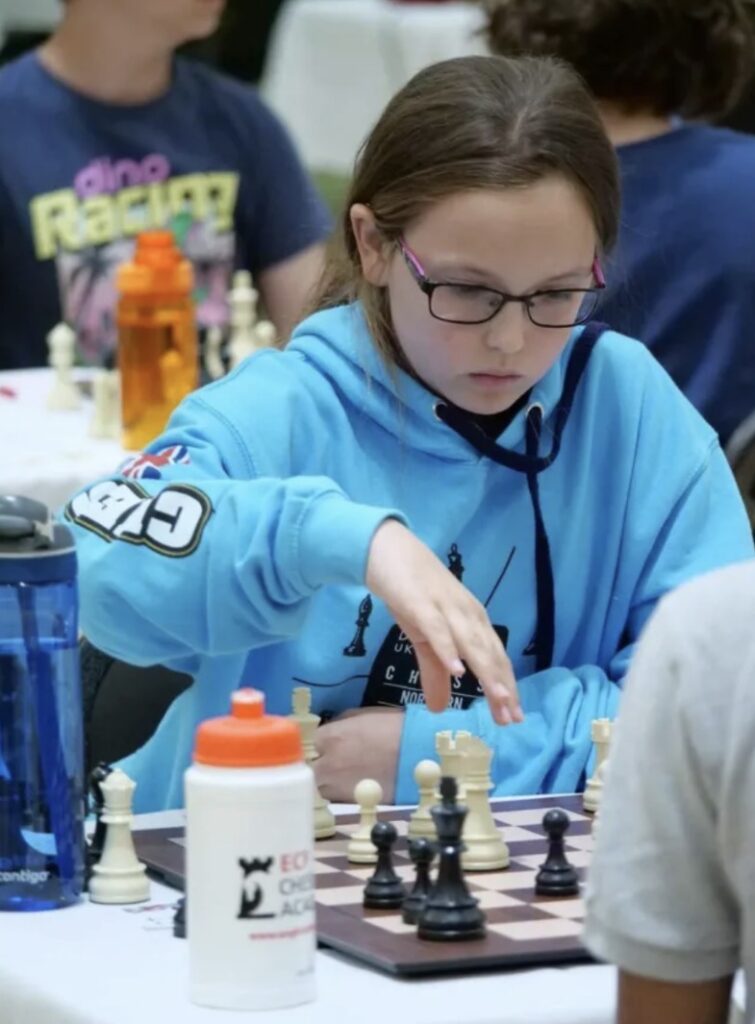 Emily Maton playing chess
