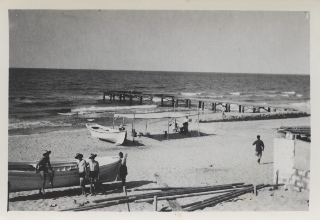 1941: Fishing boats and pier on Gaza beach
