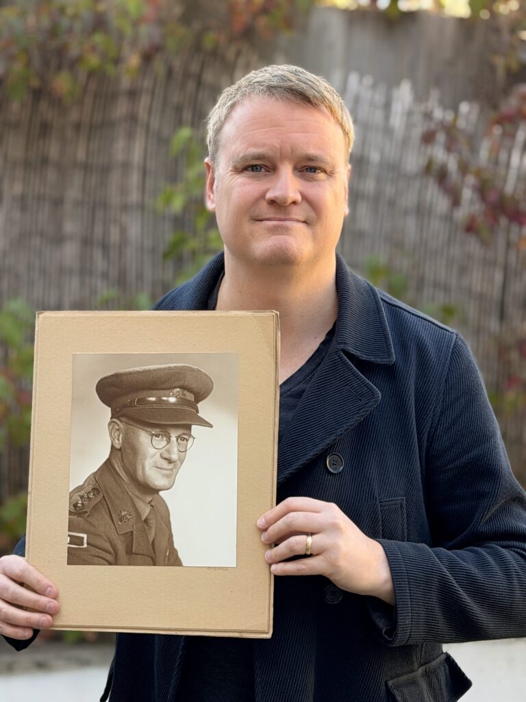 Peter with the official military portrait of his grandfather.